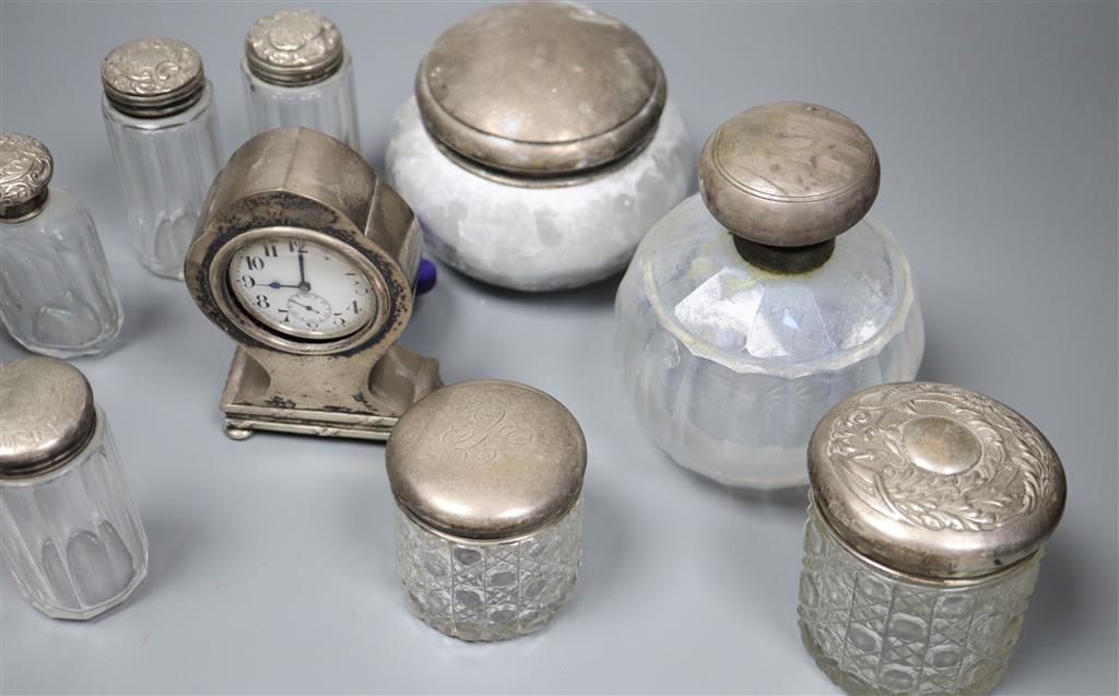 An Edwardian silver mounted balloon shaped timepiece, 11.5cm and sundry mounted toilet jars.